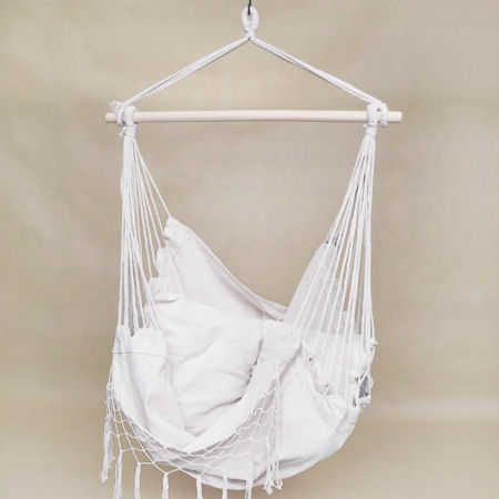 Fashionable rope hammock, BOHO-style macramé swing in natural nude colour