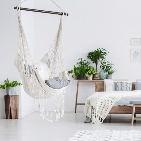 Fashionable rope hammock, BOHO-style macramé swing in natural nude colour