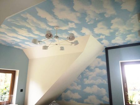 Light blue photo wallpaper with white clouds